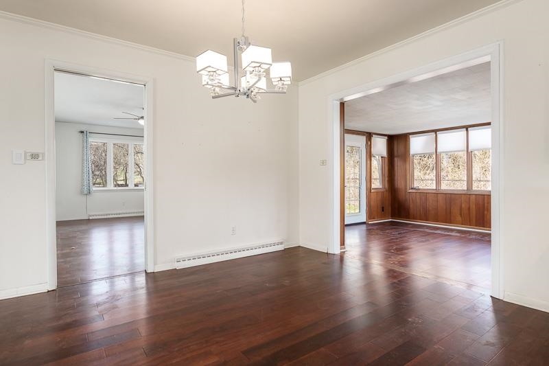 2309 Harris Road Rockford, IL 61107 - Photo 18 of 42 a view of an empty room with wooden floor and a window