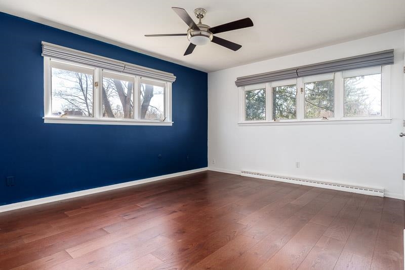 2309 Harris Road Rockford, IL 61107 - Photo 31 of 42 an empty room with wooden floor and windows