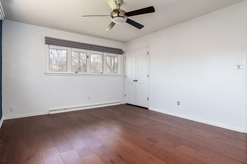 2309 Harris Road Rockford, IL 61107 - Photo 32 of 42 an empty room with wooden floor and windows
