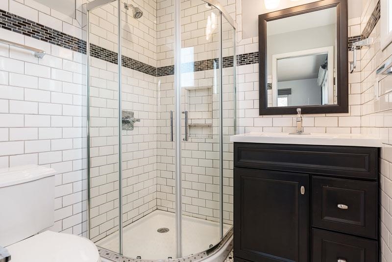2309 Harris Road Rockford, IL 61107 - Photo 34 of 42 a bathroom with a sink vanity toilet and shower