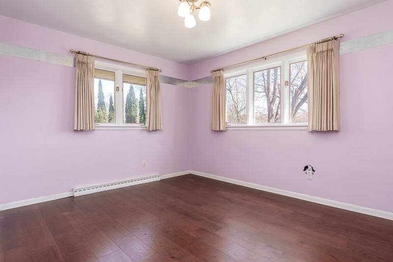 2309 Harris Road Rockford, IL 61107 - Photo 35 of 42 a view of an empty room with wooden floor and a window