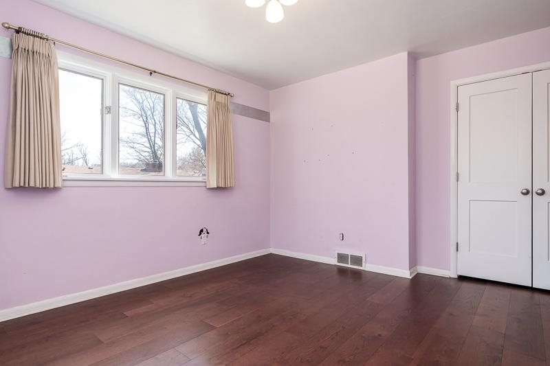 2309 Harris Road Rockford, IL 61107 - Photo 36 of 42 an empty room with wooden floor and windows