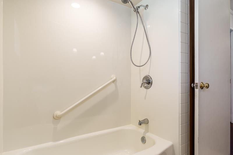 2309 Harris Road Rockford, IL 61107 - Photo 39 of 42 a bathroom with a bath tub with a shower