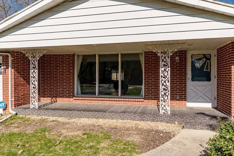 2309 Harris Road Rockford, IL 61107 - Photo 4 of 42 a front view of a house with a garage