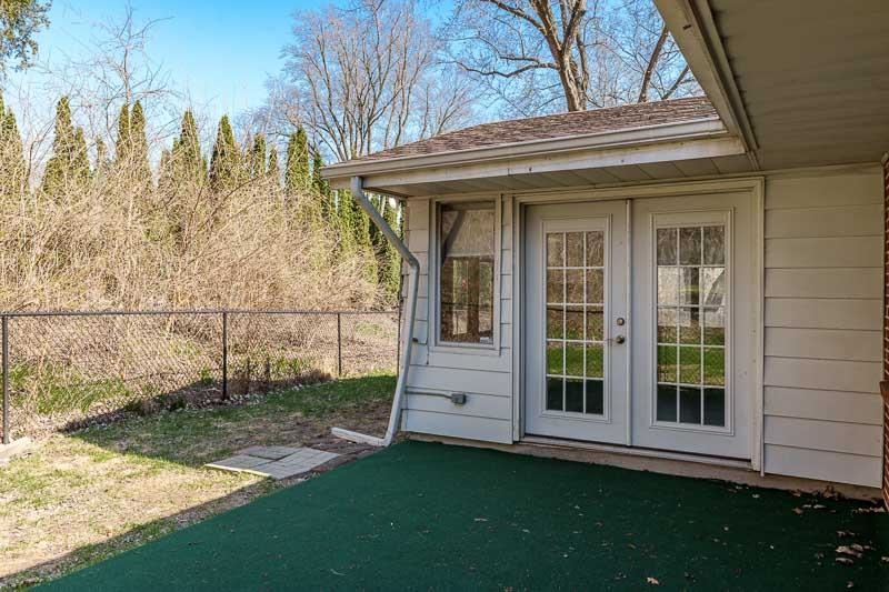 2309 Harris Road Rockford, IL 61107 - Photo 6 of 42 a view of a backyard with a large tree