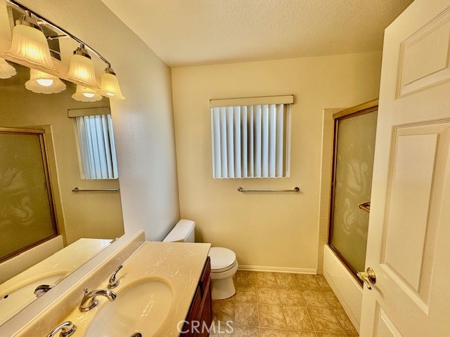 18336 Algiers Street Porter Ranch, CA 91326 - Photo 5 of 18 a bathroom with a sink and a mirror