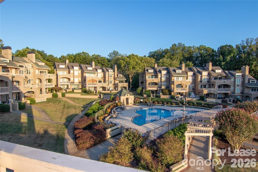 646 Portside Drive Davidson, NC 28036 - Photo 1 of 48 a view of a swimming pool and outdoor seating
