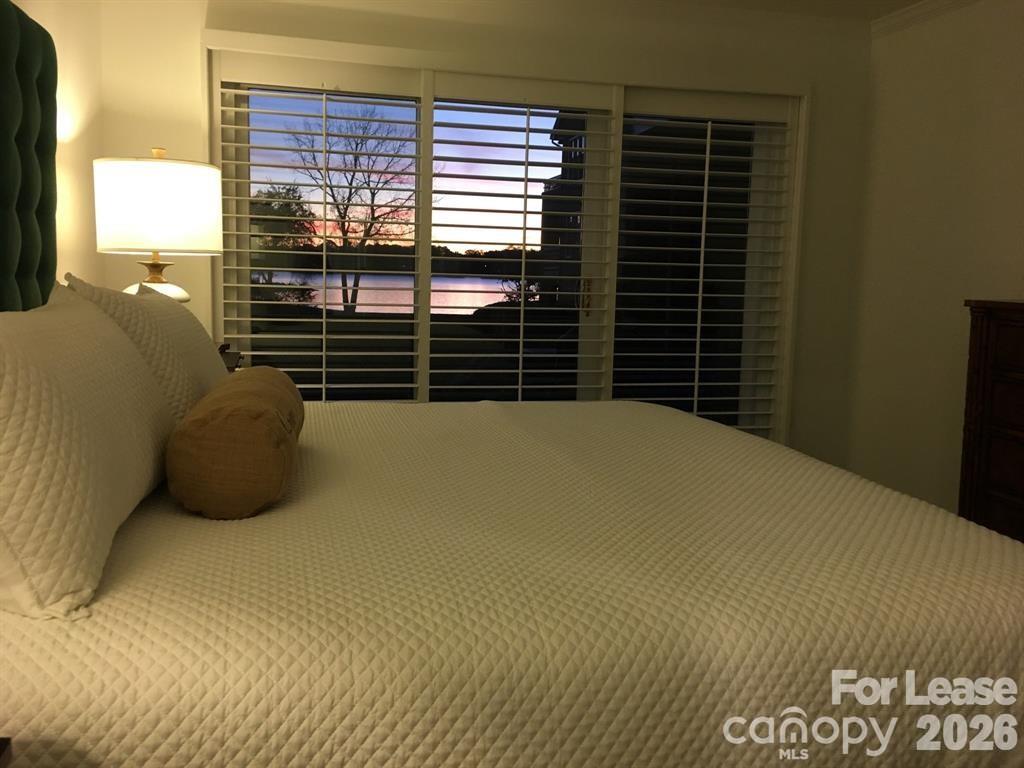 646 Portside Drive Davidson, NC 28036 - Photo 15 of 48 a bedroom with a bed and a window