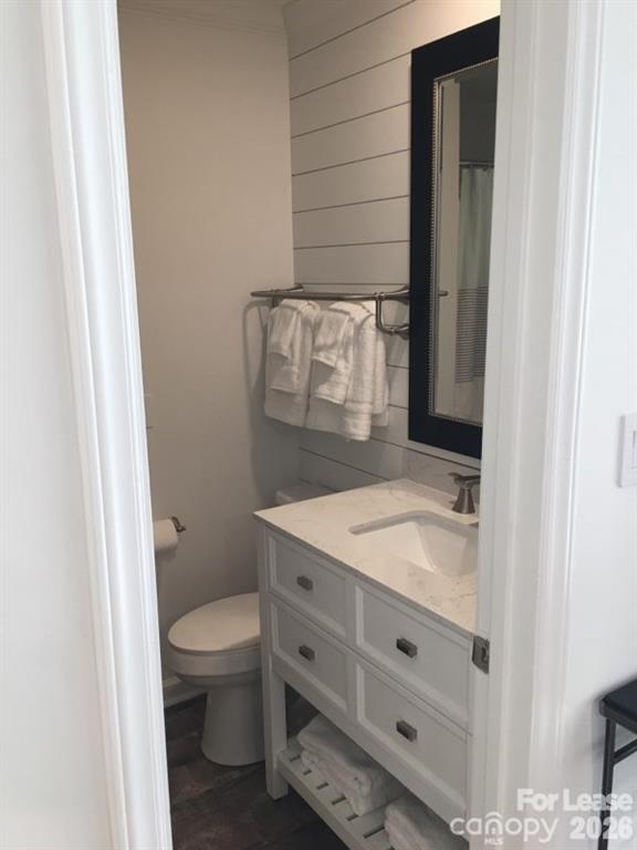 646 Portside Drive Davidson, NC 28036 - Photo 21 of 48 a bathroom with a granite countertop sink toilet and mirror