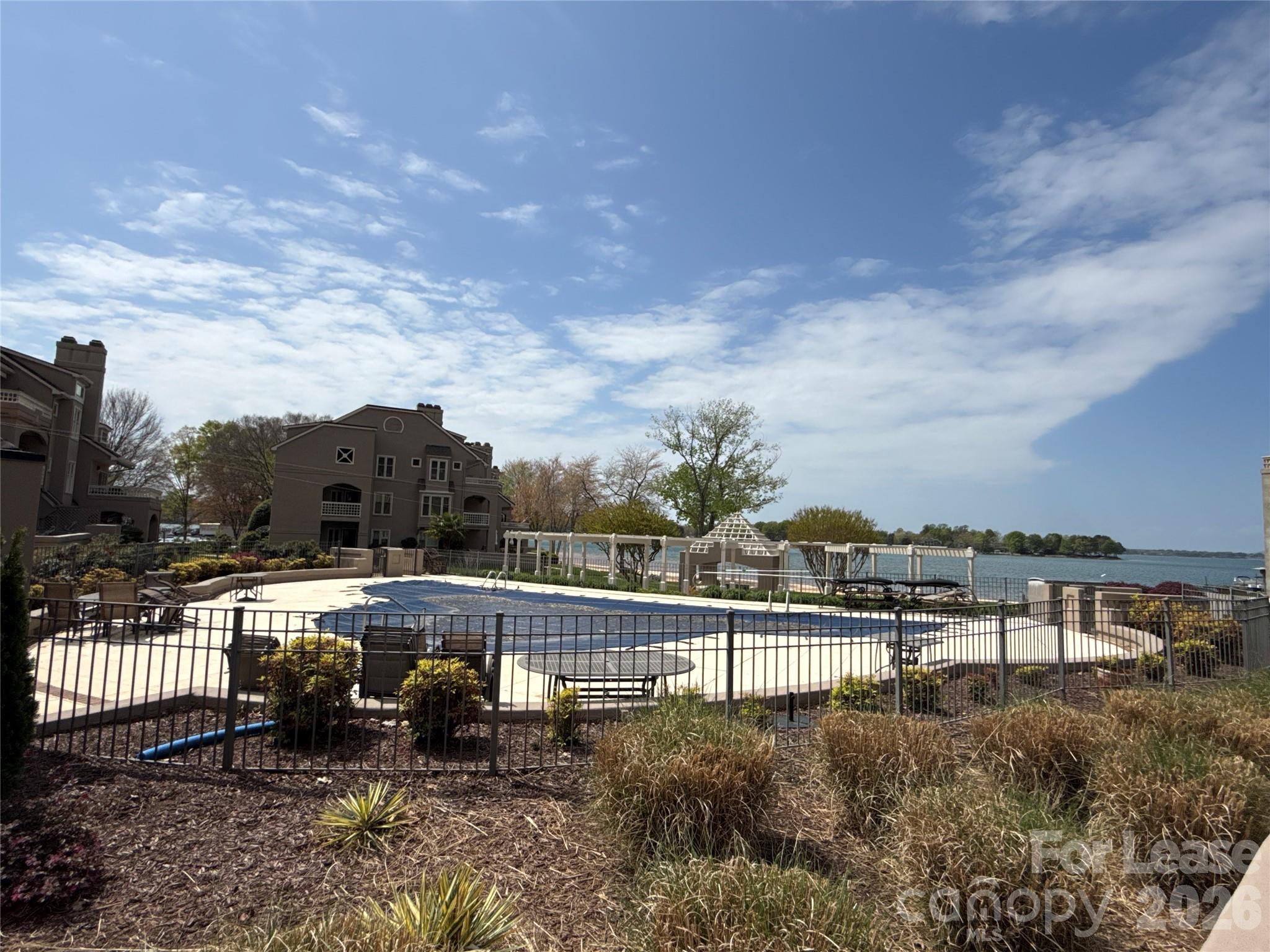646 Portside Drive Davidson, NC 28036 - Photo 41 of 48 a view of a lake with a city view
