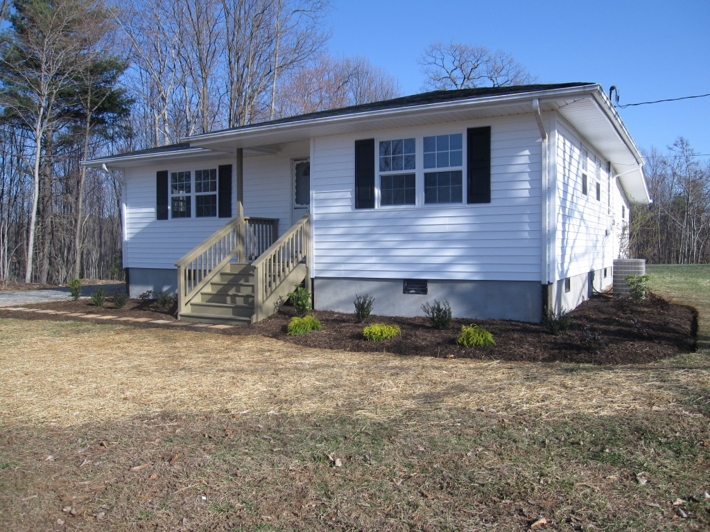 1048 Deep Woods Road Hardy, VA 24101 - Photo 1 of 17 a front view of a house with a yard
