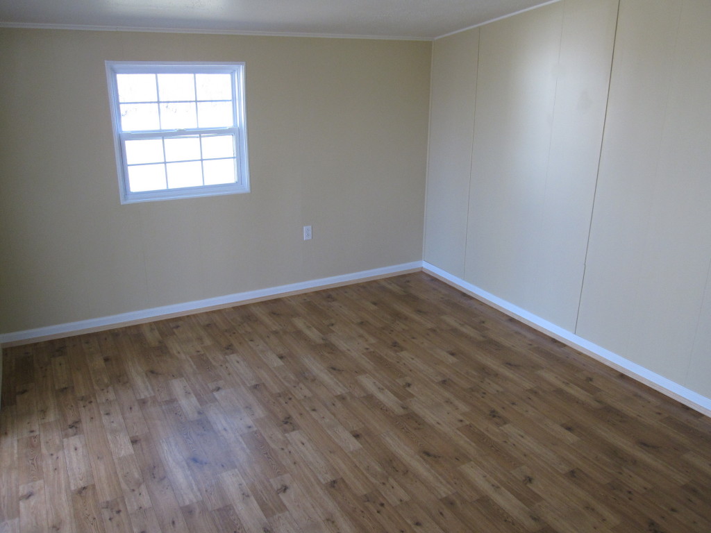 1048 Deep Woods Road Hardy, VA 24101 - Photo 9 of 17 an empty room with wooden floor and windows