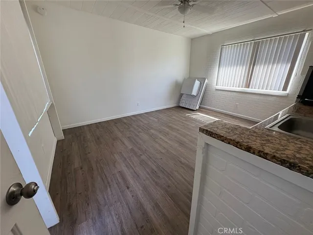 a view of a kitchen from the hallway