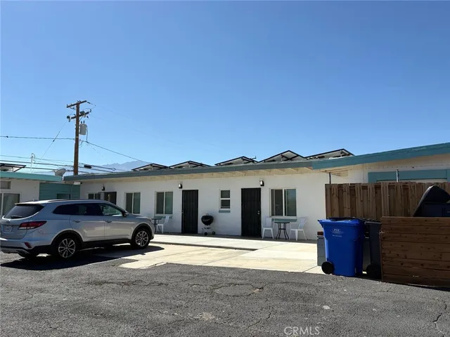 a view of a car parked in front of a house