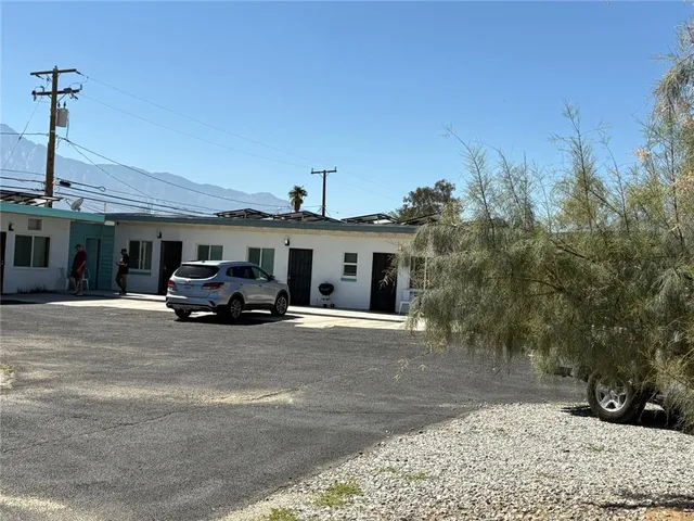a view of a car parked in front of a house
