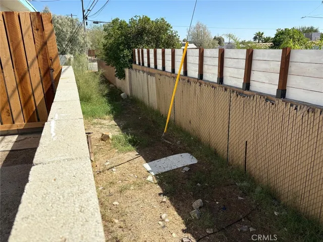 a view of balcony with wooden floor