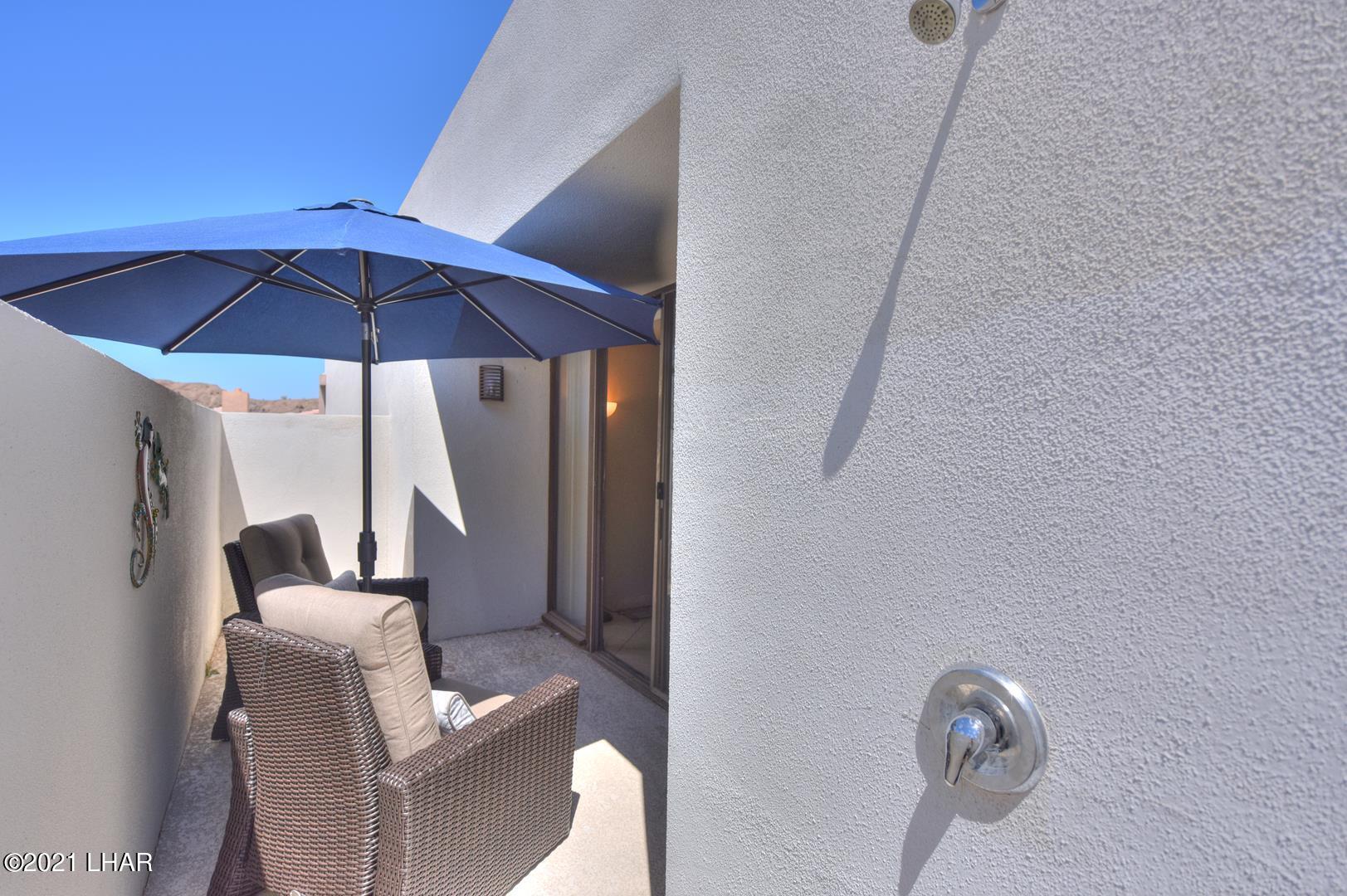 8887 Apache Loop Parker, AZ 85344 - Photo 31 of 39 OUTDOOR SHOWER IN ENCLOSED MASTER BEDROOM PATIO