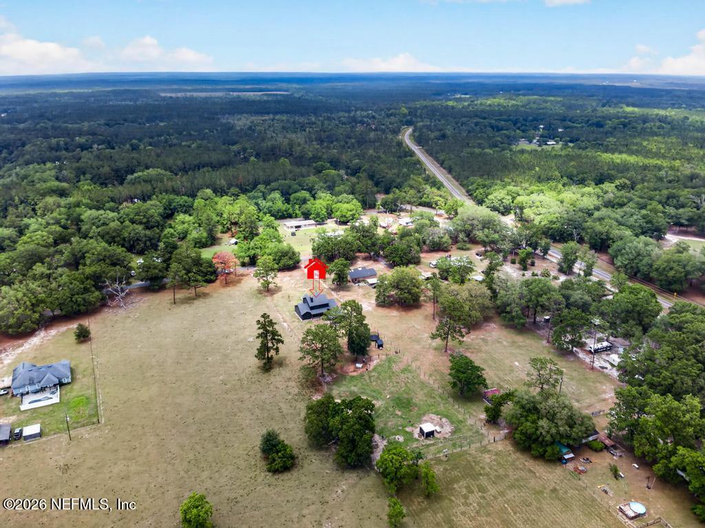 2955 Carroll Corner Road Hilliard, FL 32046 - Photo 100 of 106 an aerial view of a house with a yard