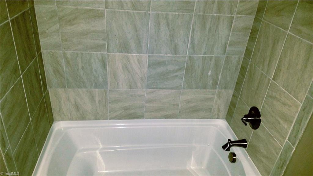 367 Briggs Road Lexington, NC 27292 - Photo 9 of 22 2ND BATHROOM-TILE SURROUNDED DEEP TUB WITH DELTA FIXTURES