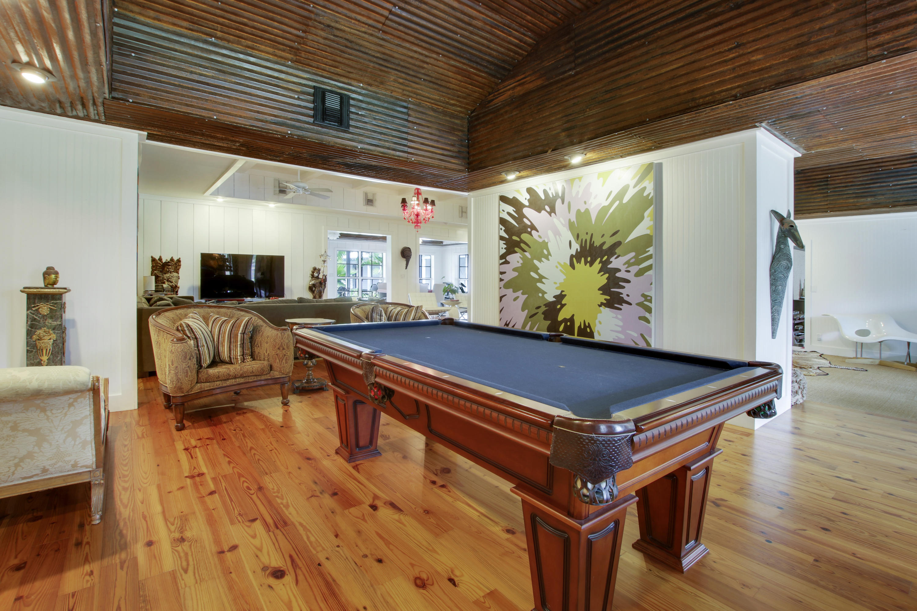 18600 Southeast Mack Dairy Road Jupiter, FL 33478 - Photo 12 of 36 a room with wooden furniture