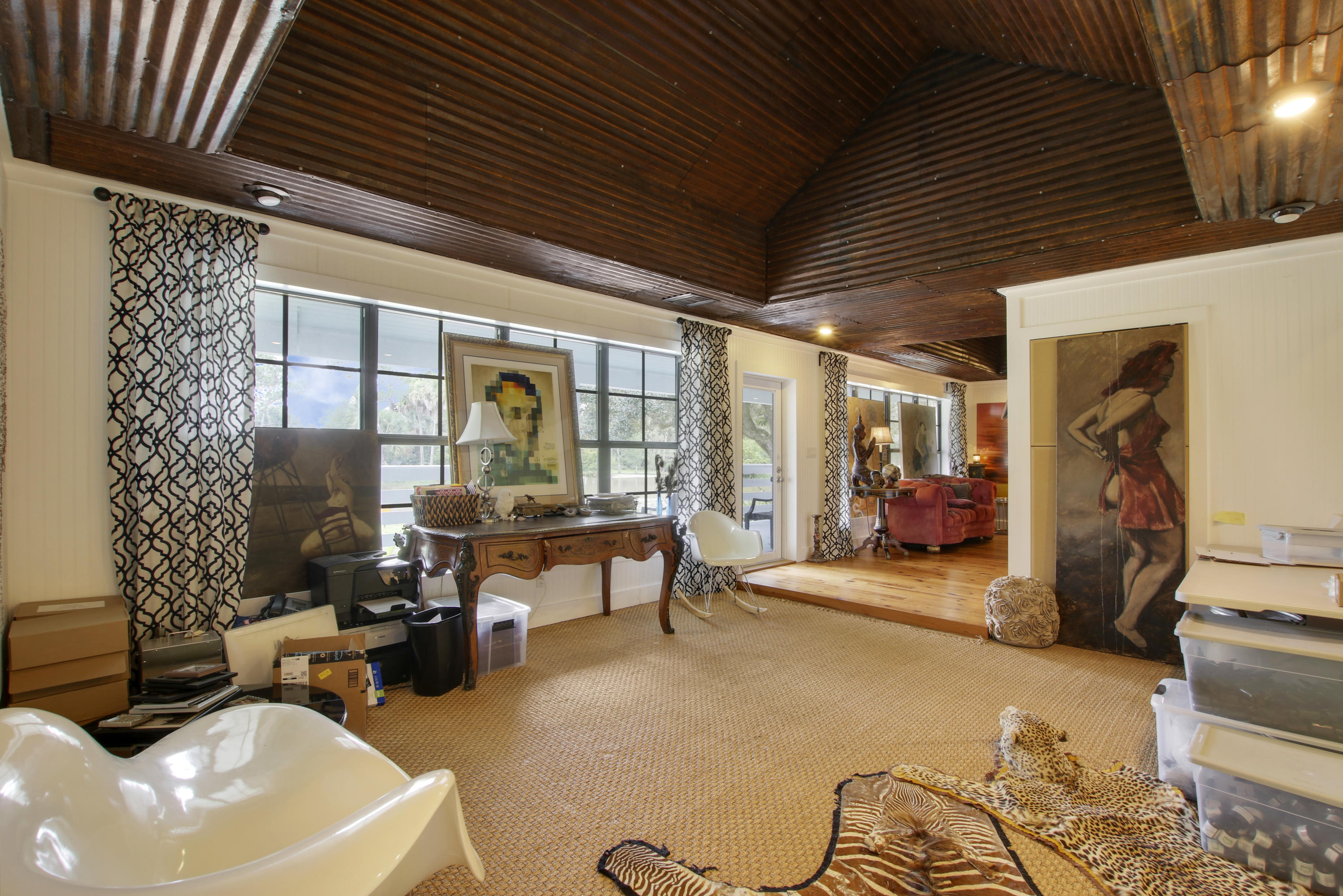 18600 Southeast Mack Dairy Road Jupiter, FL 33478 - Photo 13 of 36 a living room with furniture a couch and potted plants