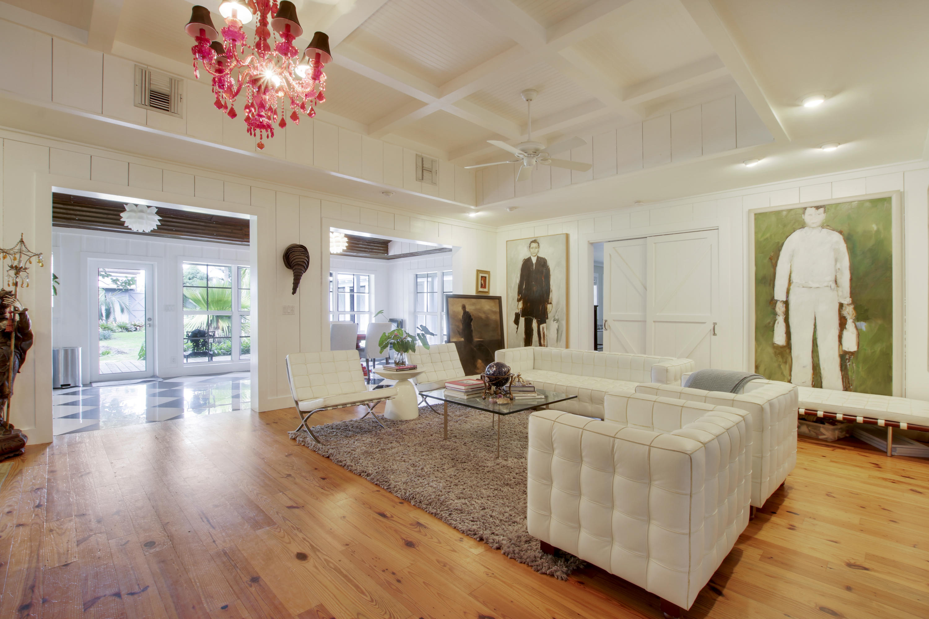 18600 Southeast Mack Dairy Road Jupiter, FL 33478 - Photo 14 of 36 a living room with furniture flowerpot and wooden floor
