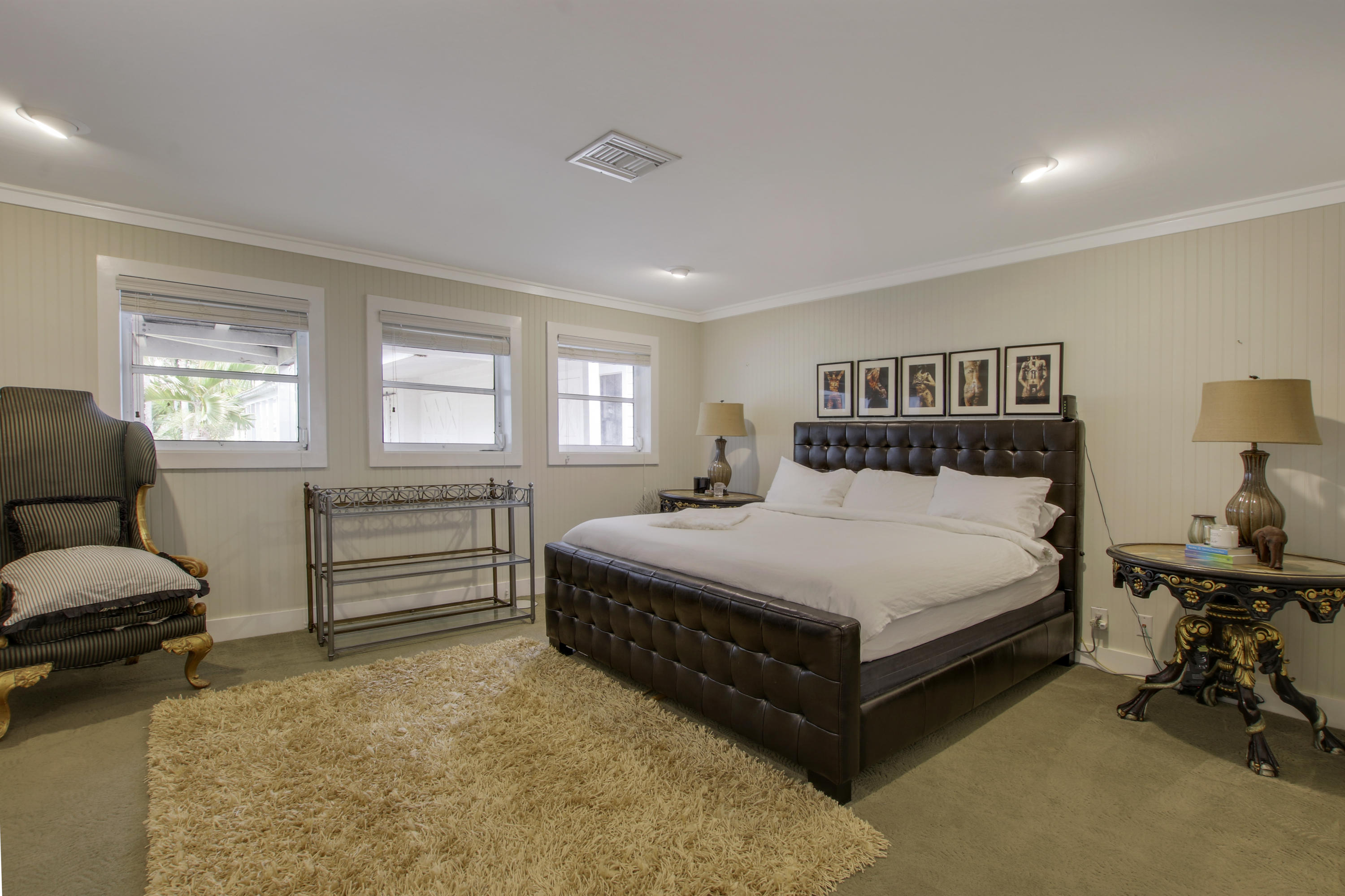 18600 Southeast Mack Dairy Road Jupiter, FL 33478 - Photo 19 of 36 a bedroom with a bed and a couch