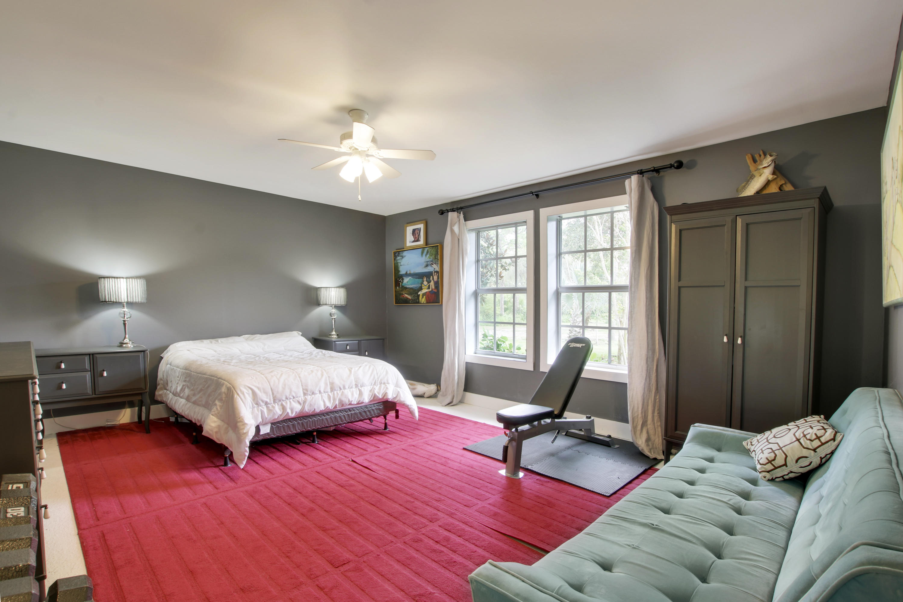 18600 Southeast Mack Dairy Road Jupiter, FL 33478 - Photo 23 of 36 a bedroom with a bed furniture and a window