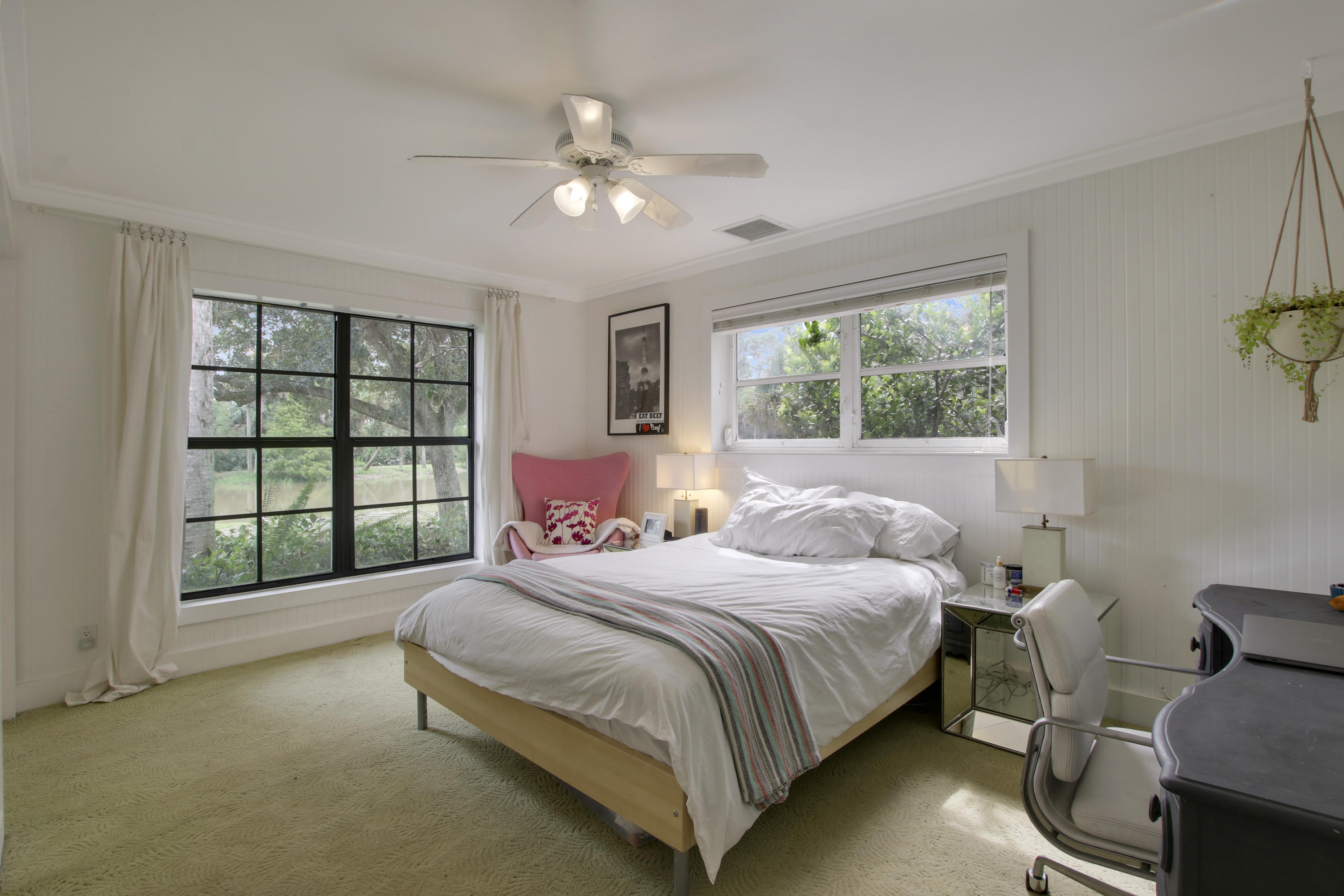 18600 Southeast Mack Dairy Road Jupiter, FL 33478 - Photo 24 of 36 a bedroom with a bed and a window