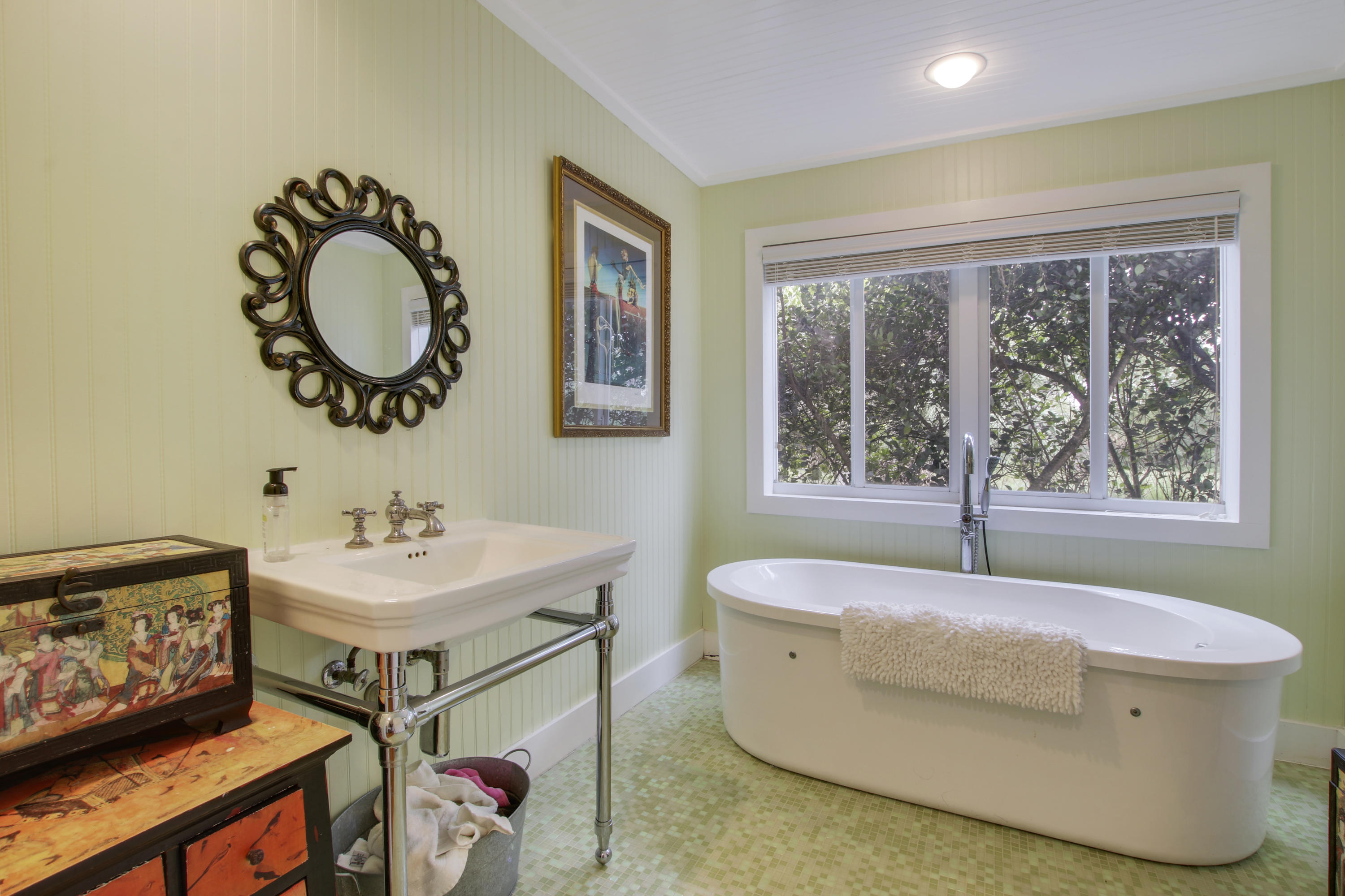 18600 Southeast Mack Dairy Road Jupiter, FL 33478 - Photo 25 of 36 a bathroom with a sink and a mirror