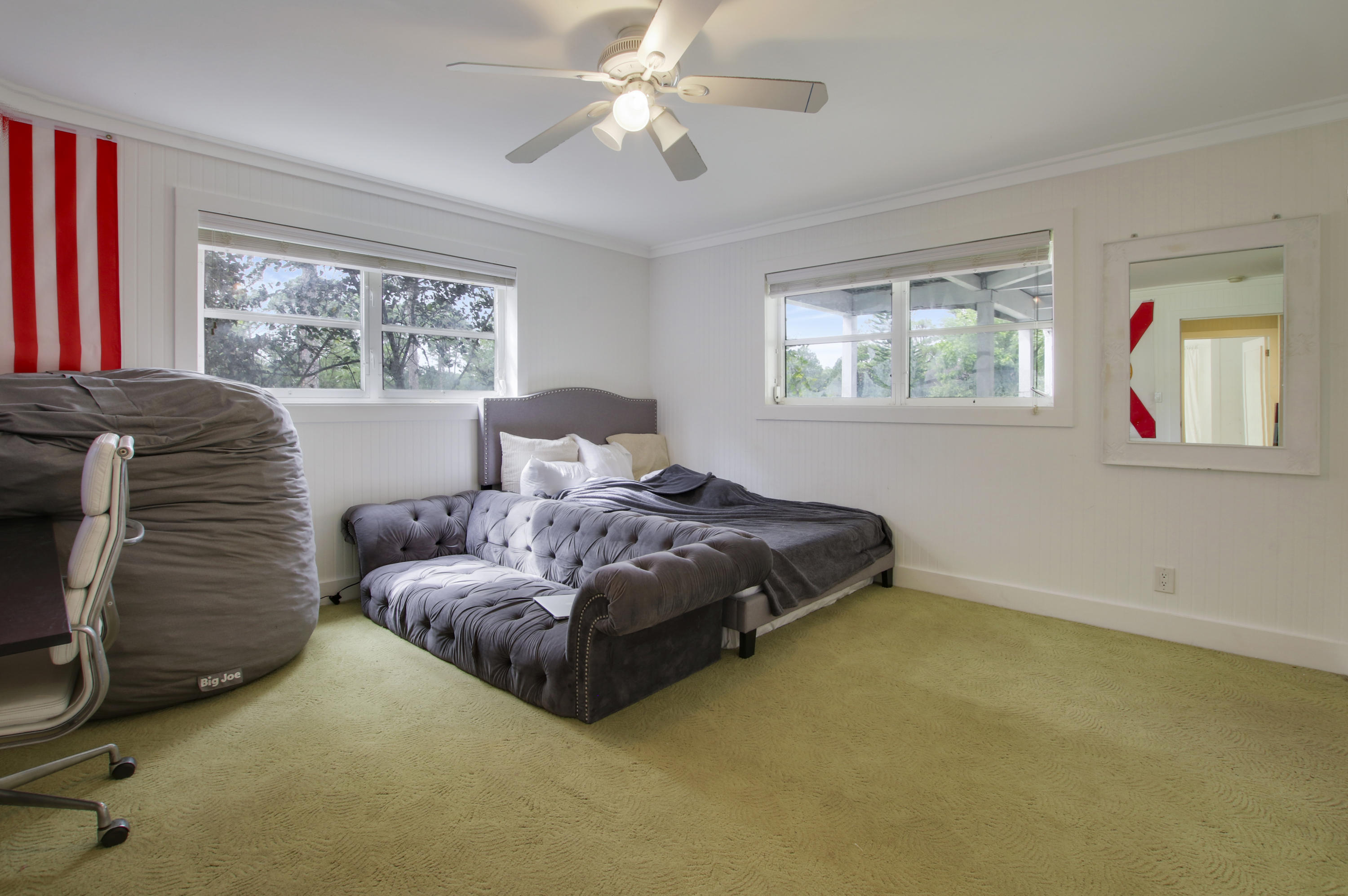 18600 Southeast Mack Dairy Road Jupiter, FL 33478 - Photo 26 of 36 a bedroom with a bed and a window