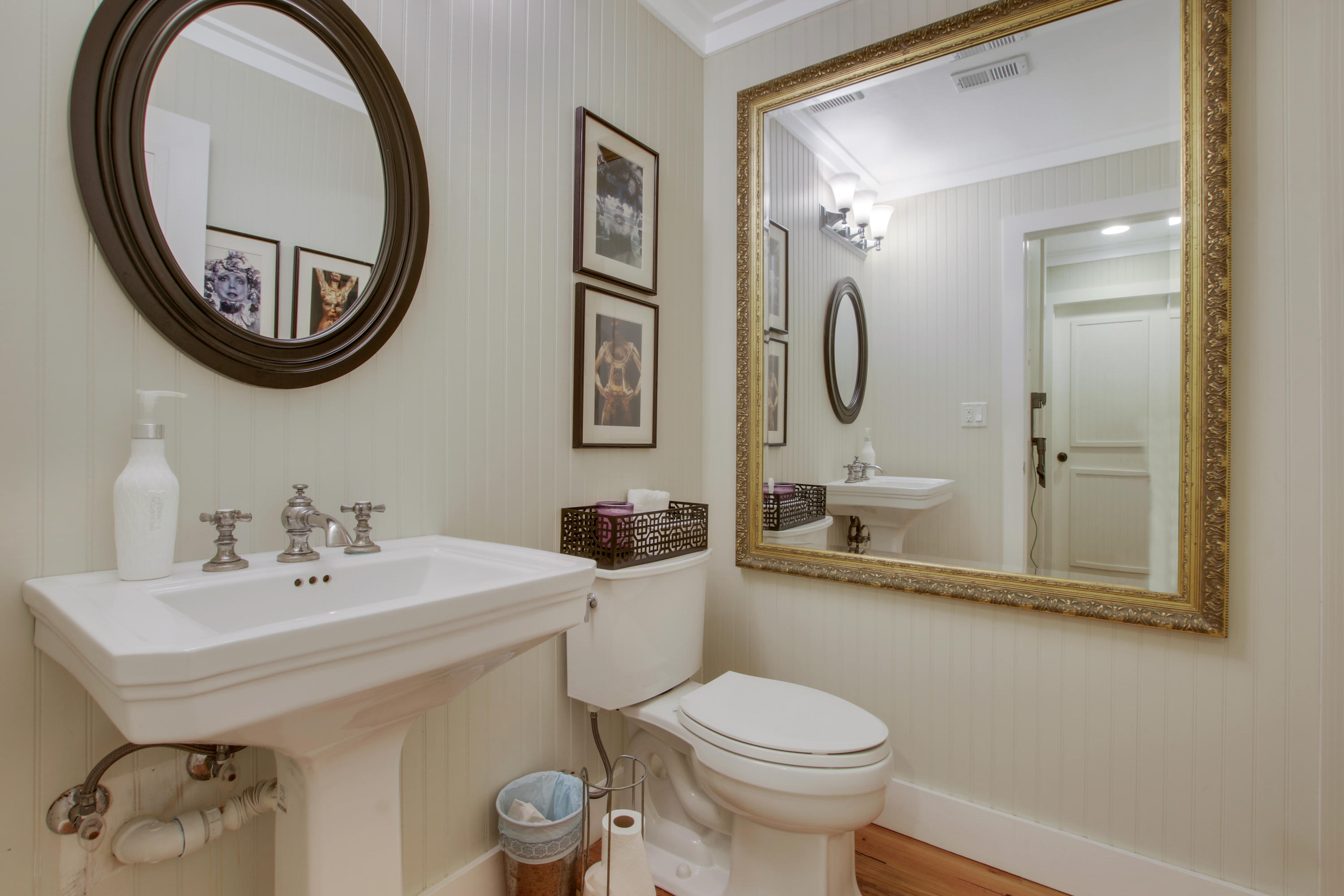 18600 Southeast Mack Dairy Road Jupiter, FL 33478 - Photo 27 of 36 a bathroom with a toilet a sink and a mirror