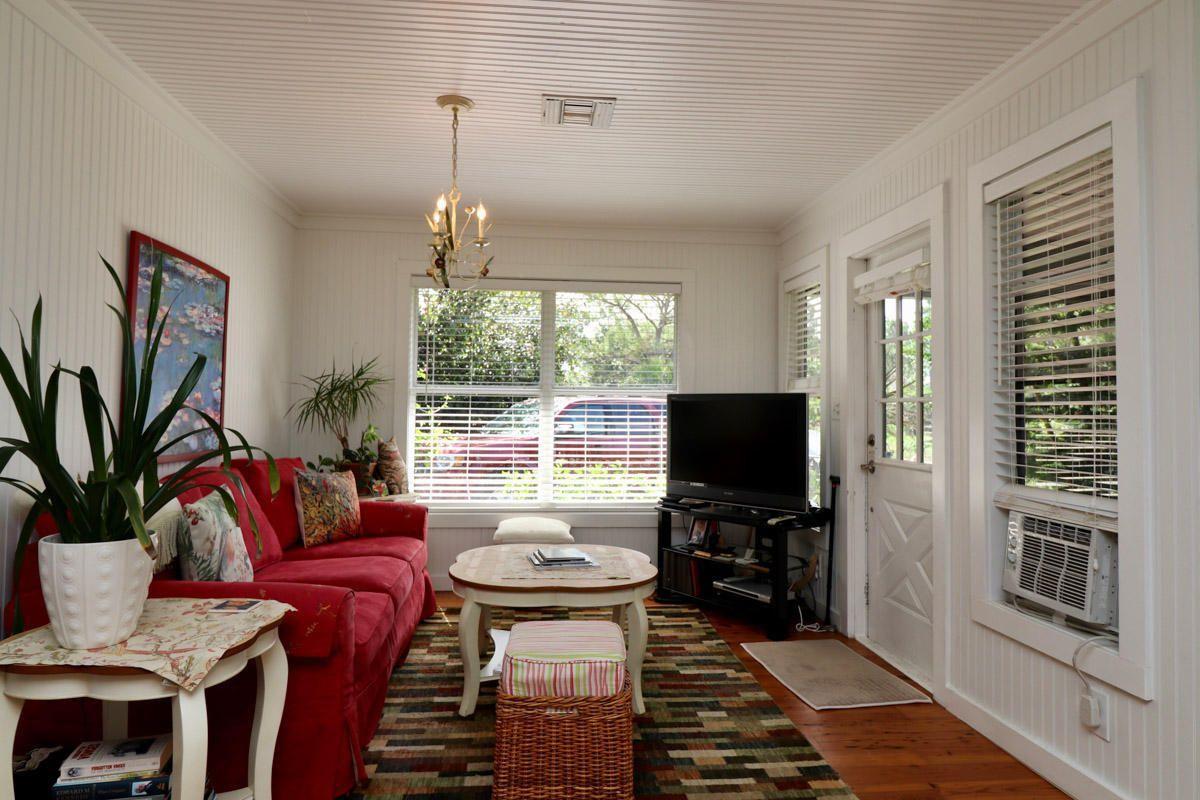 18600 Southeast Mack Dairy Road Jupiter, FL 33478 - Photo 33 of 36 a living room with furniture and a flat screen tv