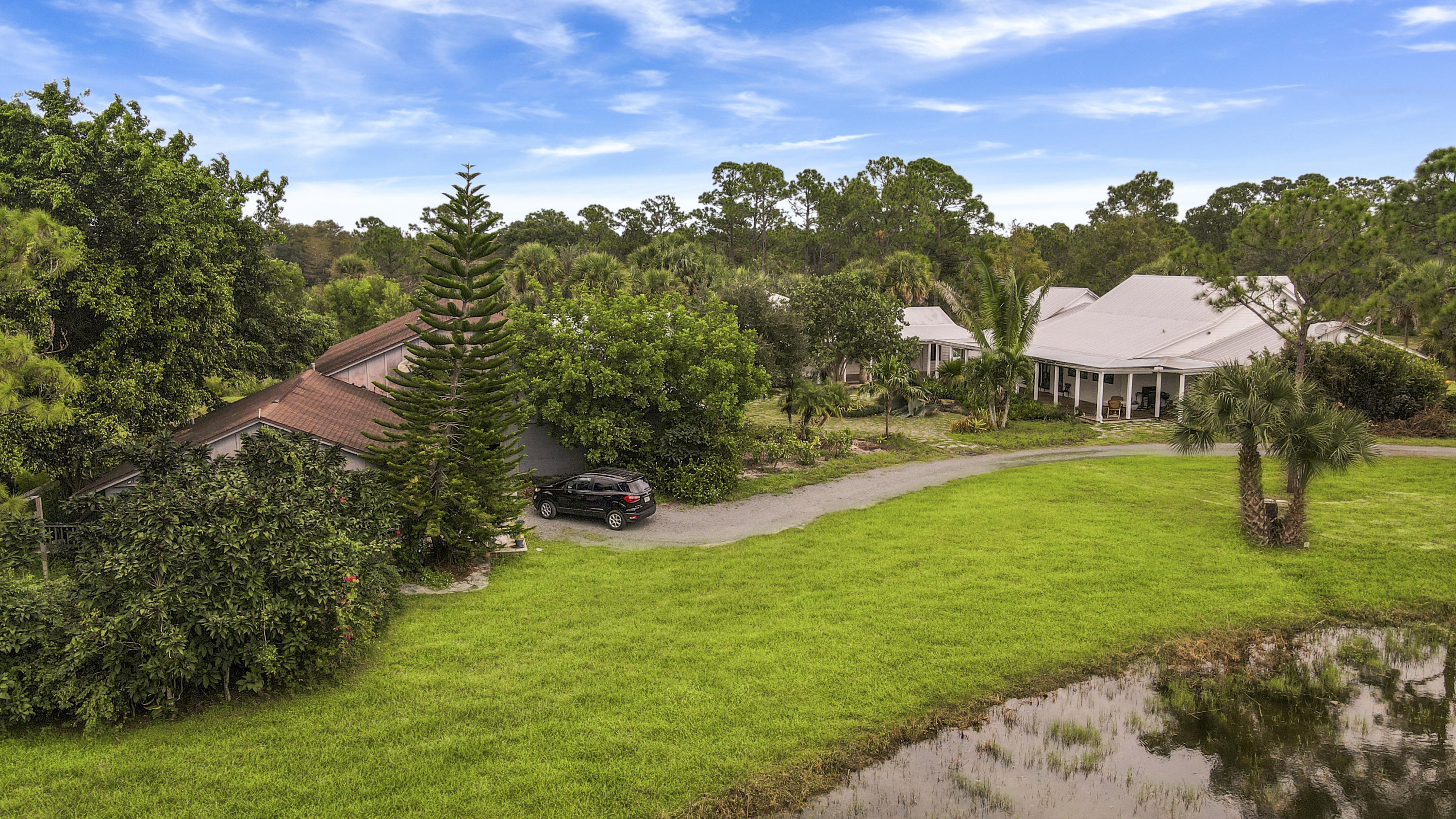 18600 Southeast Mack Dairy Road Jupiter, FL 33478 - Photo 6 of 36 a view of a lake with a yard
