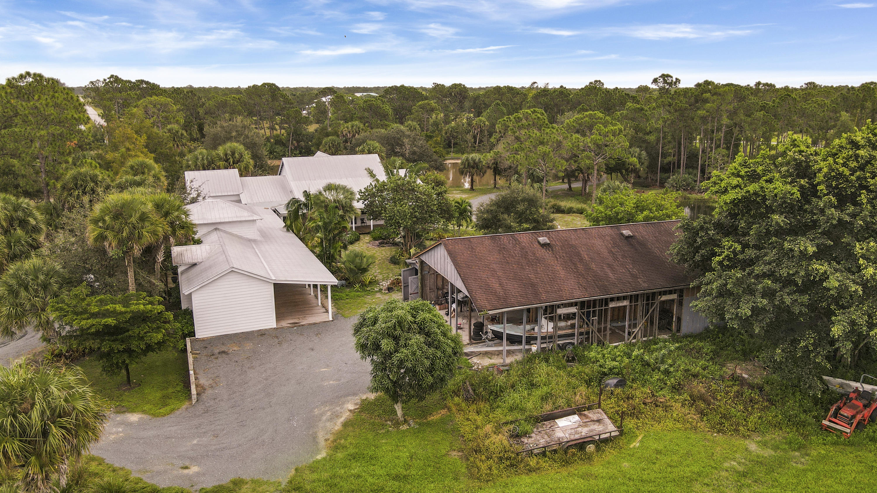 18600 Southeast Mack Dairy Road Jupiter, FL 33478 - Photo 8 of 36 an aerial view of a house with yard and mountain view in back