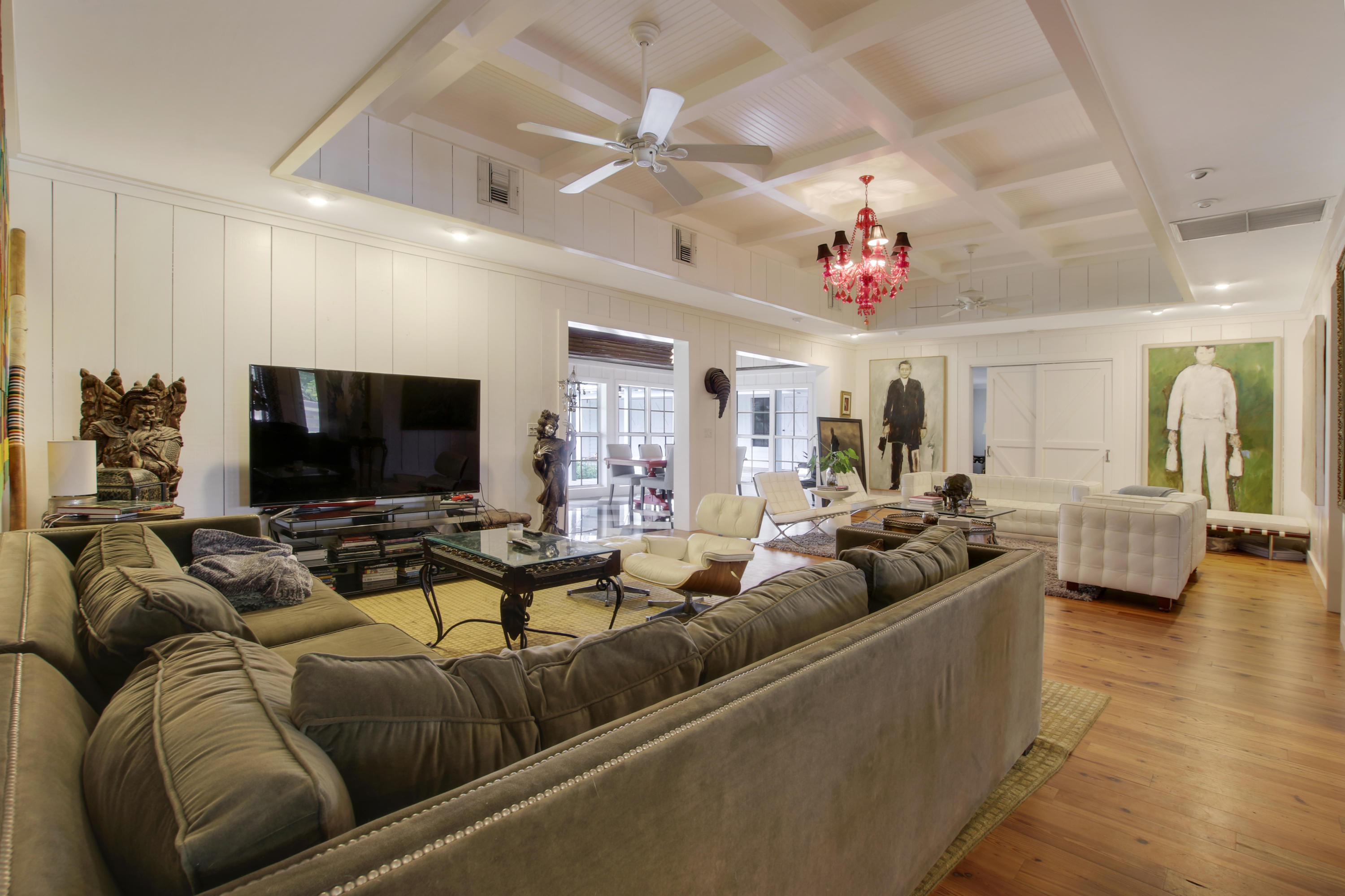 18600 Southeast Mack Dairy Road Jupiter, FL 33478 - Photo 9 of 36 a living room with furniture and a flat screen tv