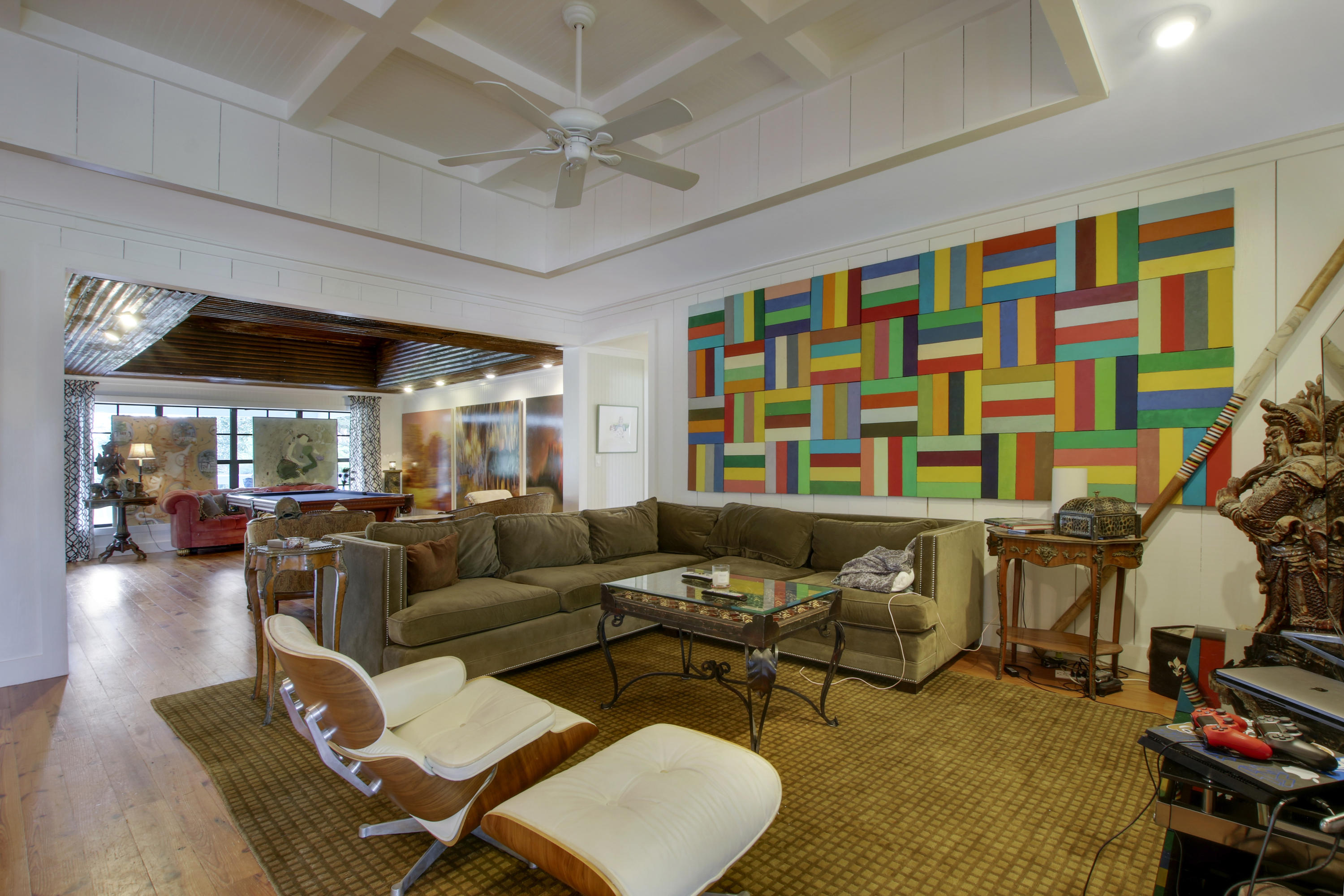 18600 Southeast Mack Dairy Road Jupiter, FL 33478 - Photo 10 of 36 a living room with furniture and a flat screen tv