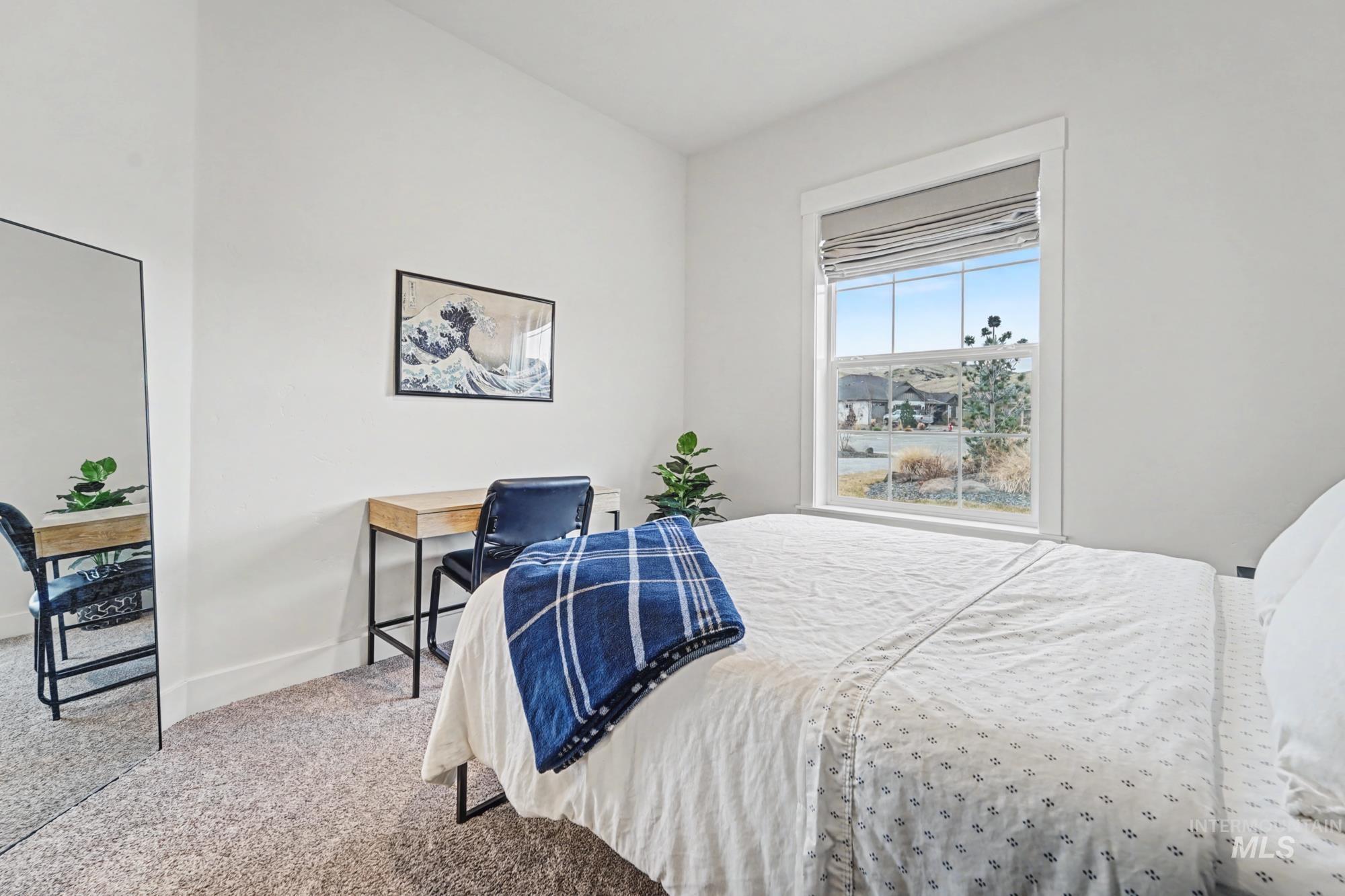 18357 North Burnt Car Way Boise, ID 83714 - Photo 38 of 48 Carpeted bedroom with baseboards