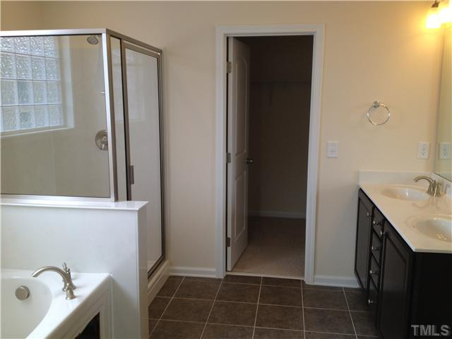 9 Hidden Ridge Court Durham, NC 27707 - Photo 11 of 25 Large walk in closet is off the owner's bath. Owner's bath has seperate shower and tub with beautiful tile & upgraded cabinets!