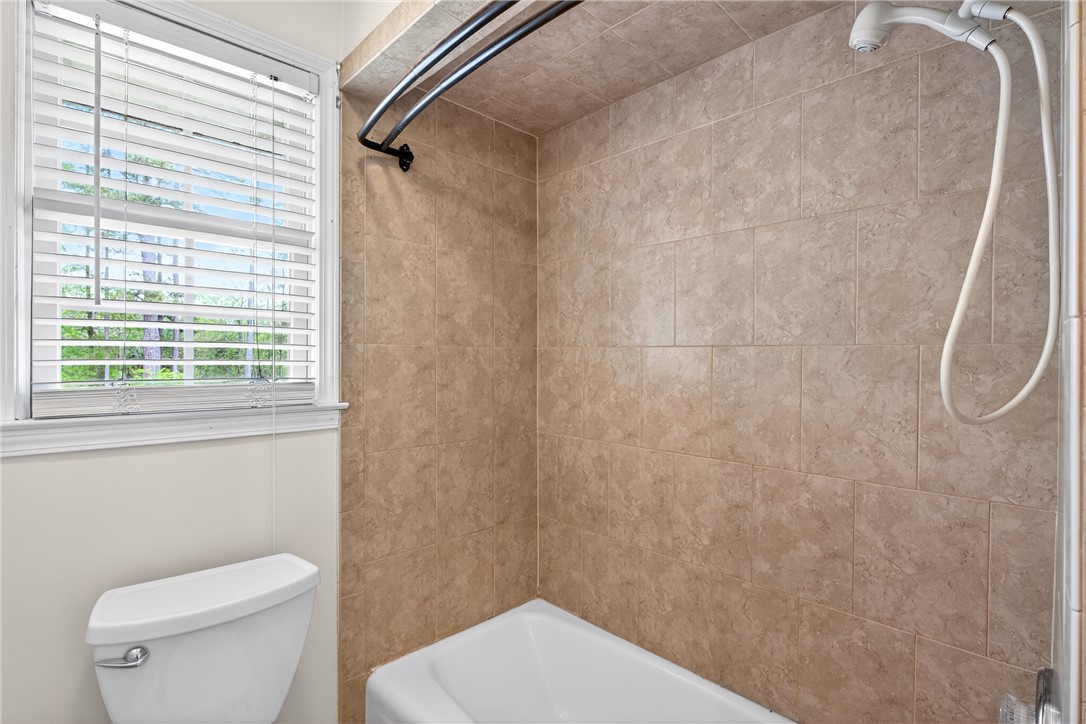 160 Burdette Circle Pendleton, SC 29670 - Photo 15 of 38 This bathroom features durable tile walls, a classic tub, and a window for natural light.
