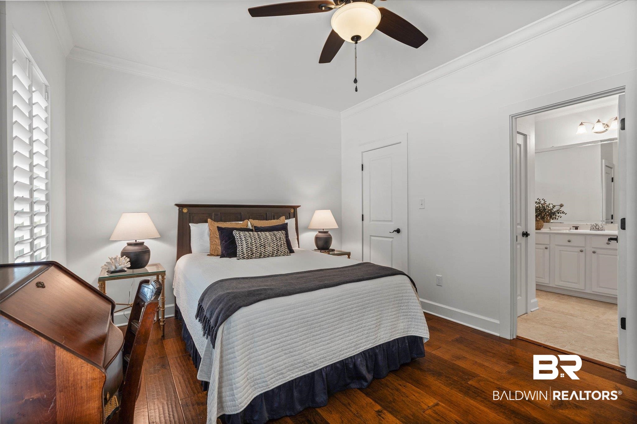 1052 Linlen Avenue Mobile, AL 36609 - Photo 14 of 22 Bedroom featuring ornamental molding, dark wood-style flooring, ceiling fan, and ensuite bath