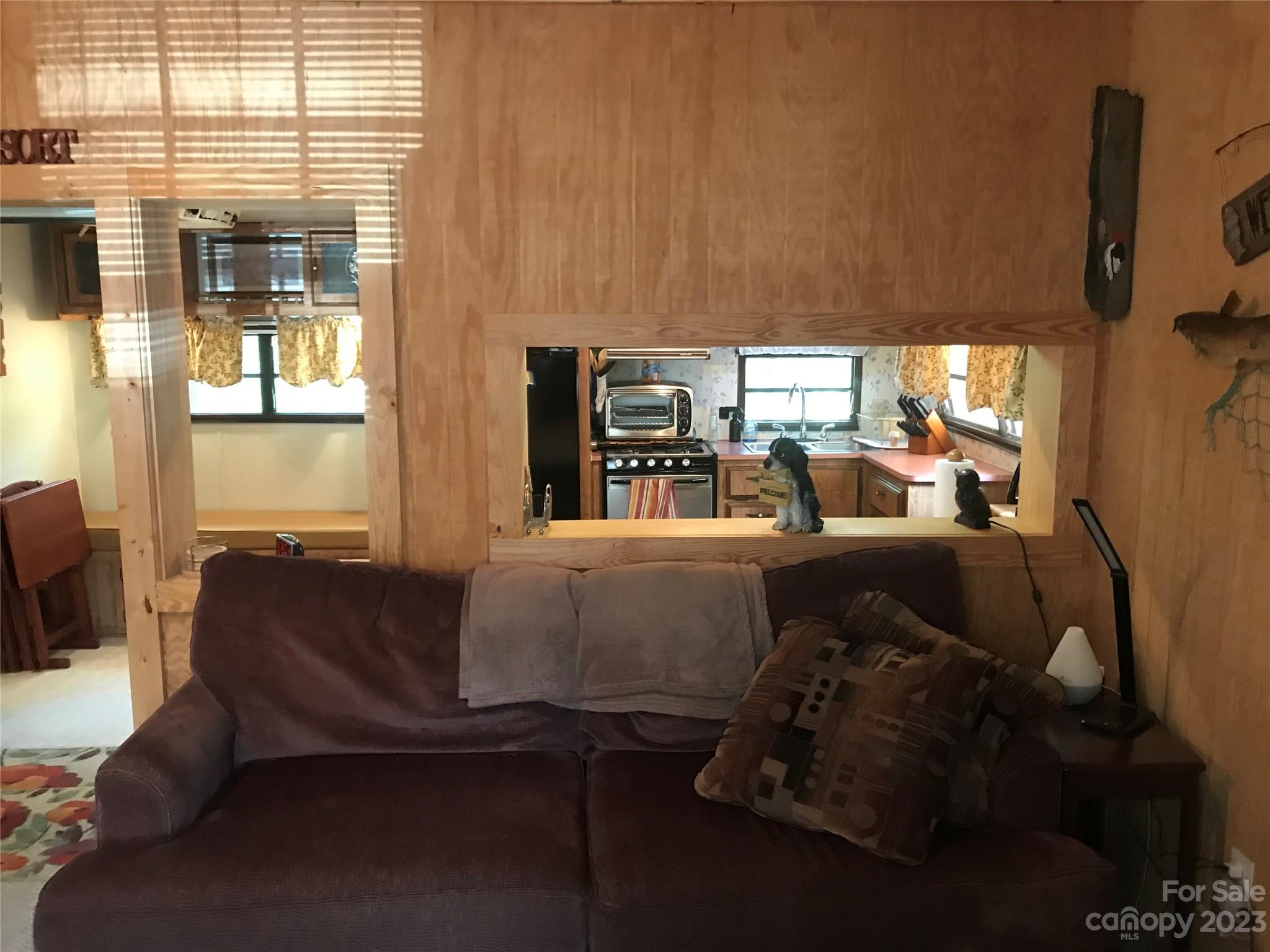 154 Roberts Ridge Road Mount Gilead, NC 27306 - Photo 13 of 35 a living room with furniture and large window