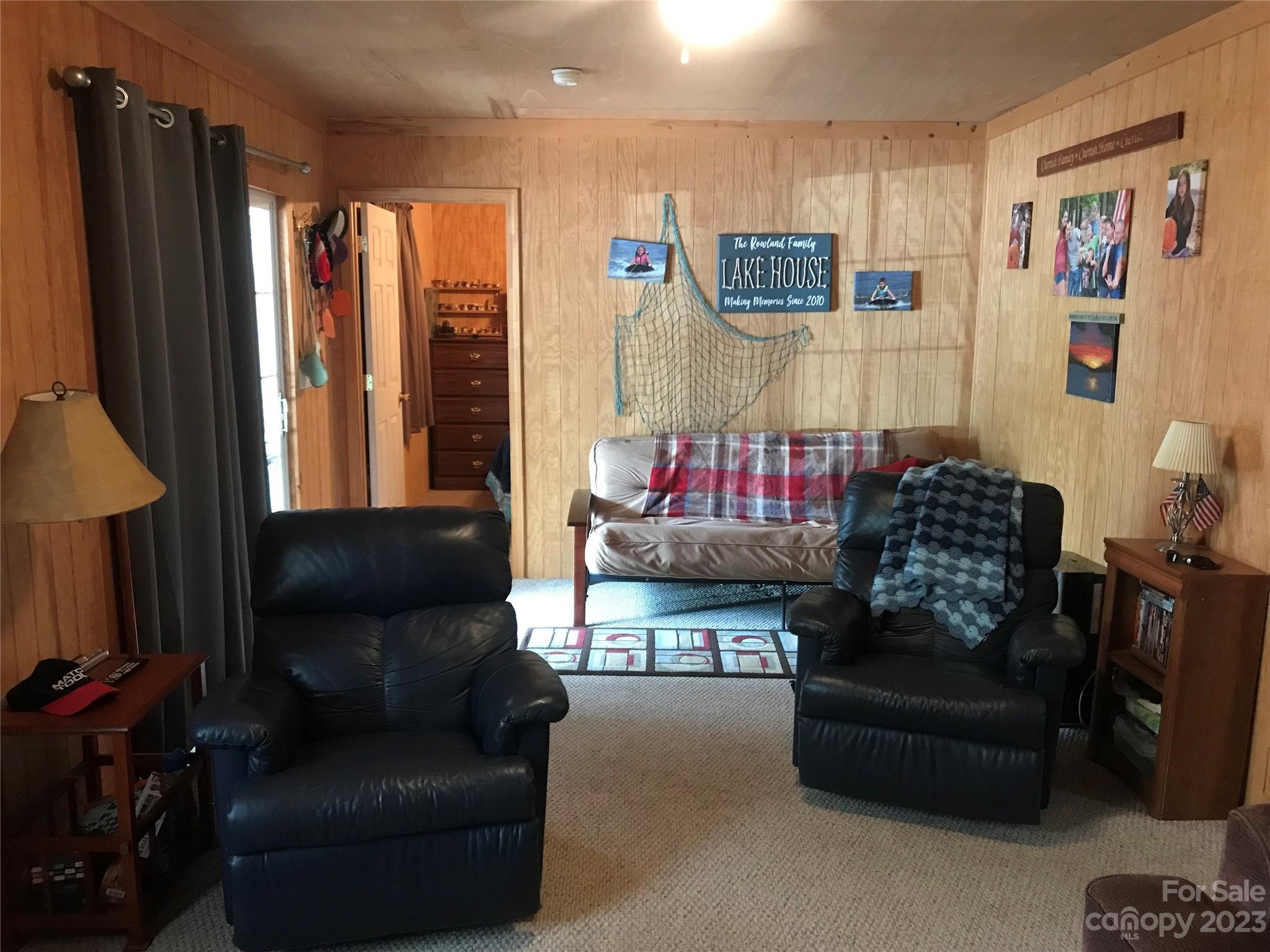 154 Roberts Ridge Road Mount Gilead, NC 27306 - Photo 14 of 35 a living room with furniture and a flat screen tv
