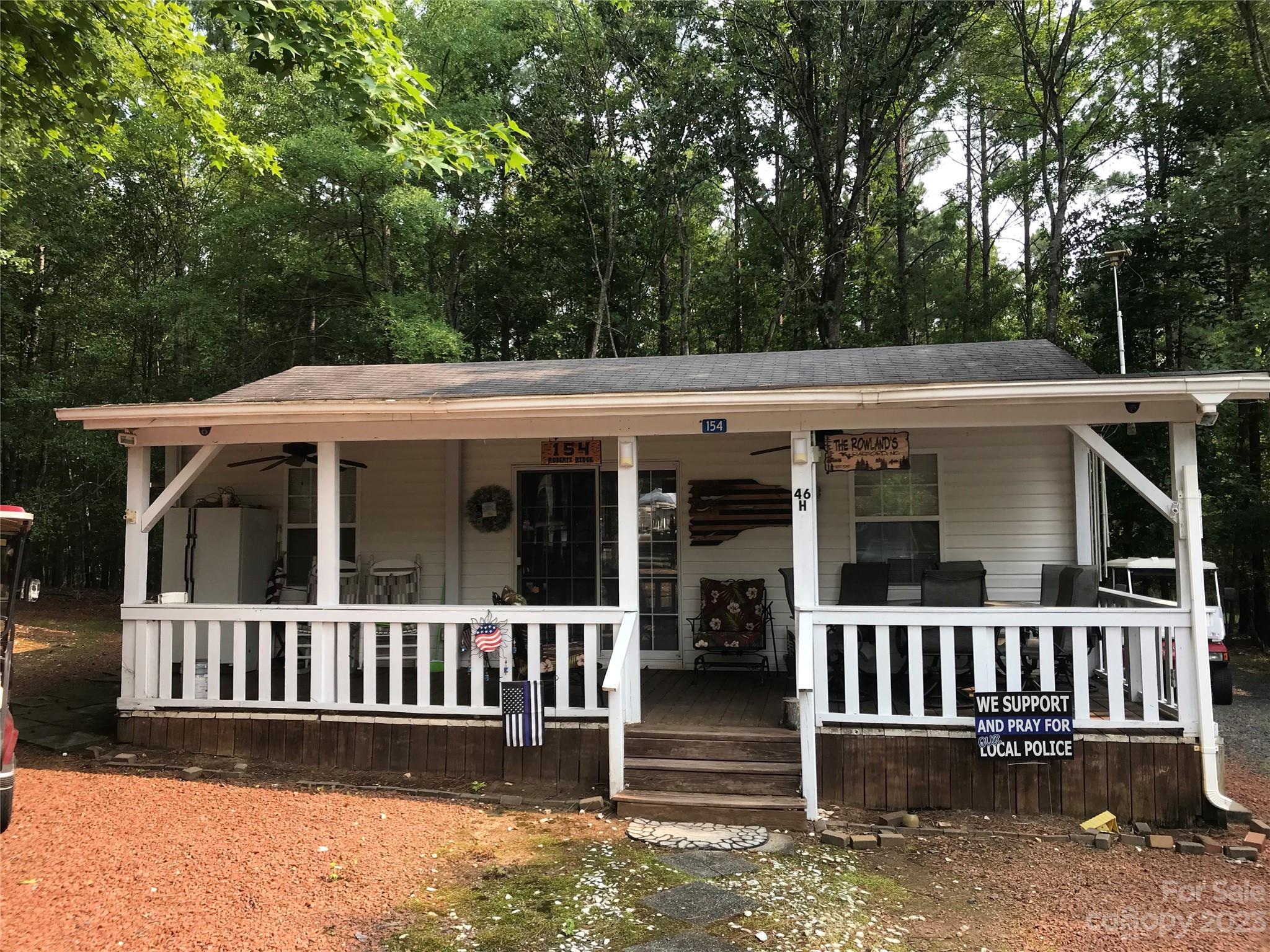 154 Roberts Ridge Road Mount Gilead, NC 27306 - Photo 2 of 35 front view of a house with a porch