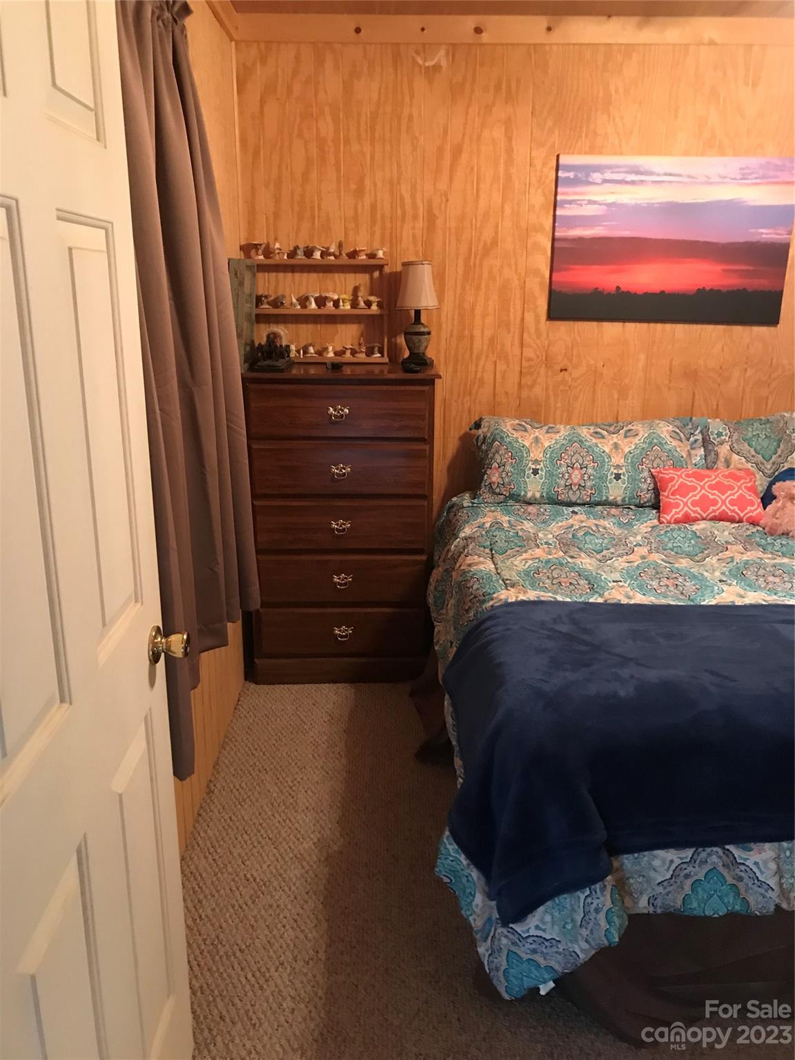 154 Roberts Ridge Road Mount Gilead, NC 27306 - Photo 21 of 35 a bed sitting in a bedroom next to a window