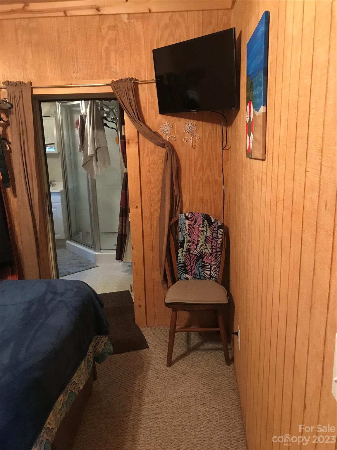 154 Roberts Ridge Road Mount Gilead, NC 27306 - Photo 25 of 35 a view of balcony with furniture and a flat screen tv