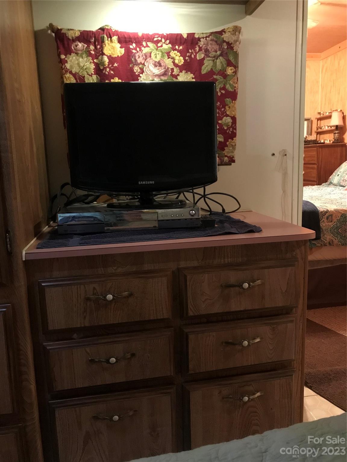 154 Roberts Ridge Road Mount Gilead, NC 27306 - Photo 27 of 35 a room with wooden floor and flat screen tv