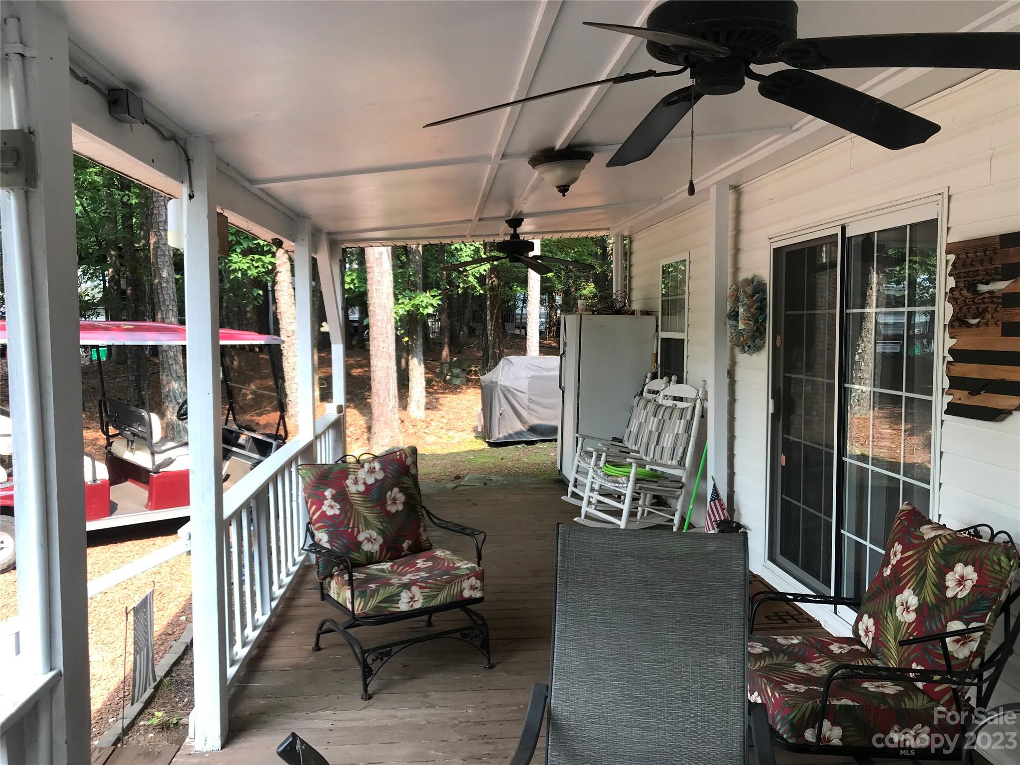 154 Roberts Ridge Road Mount Gilead, NC 27306 - Photo 7 of 35 a view of a porch with furniture