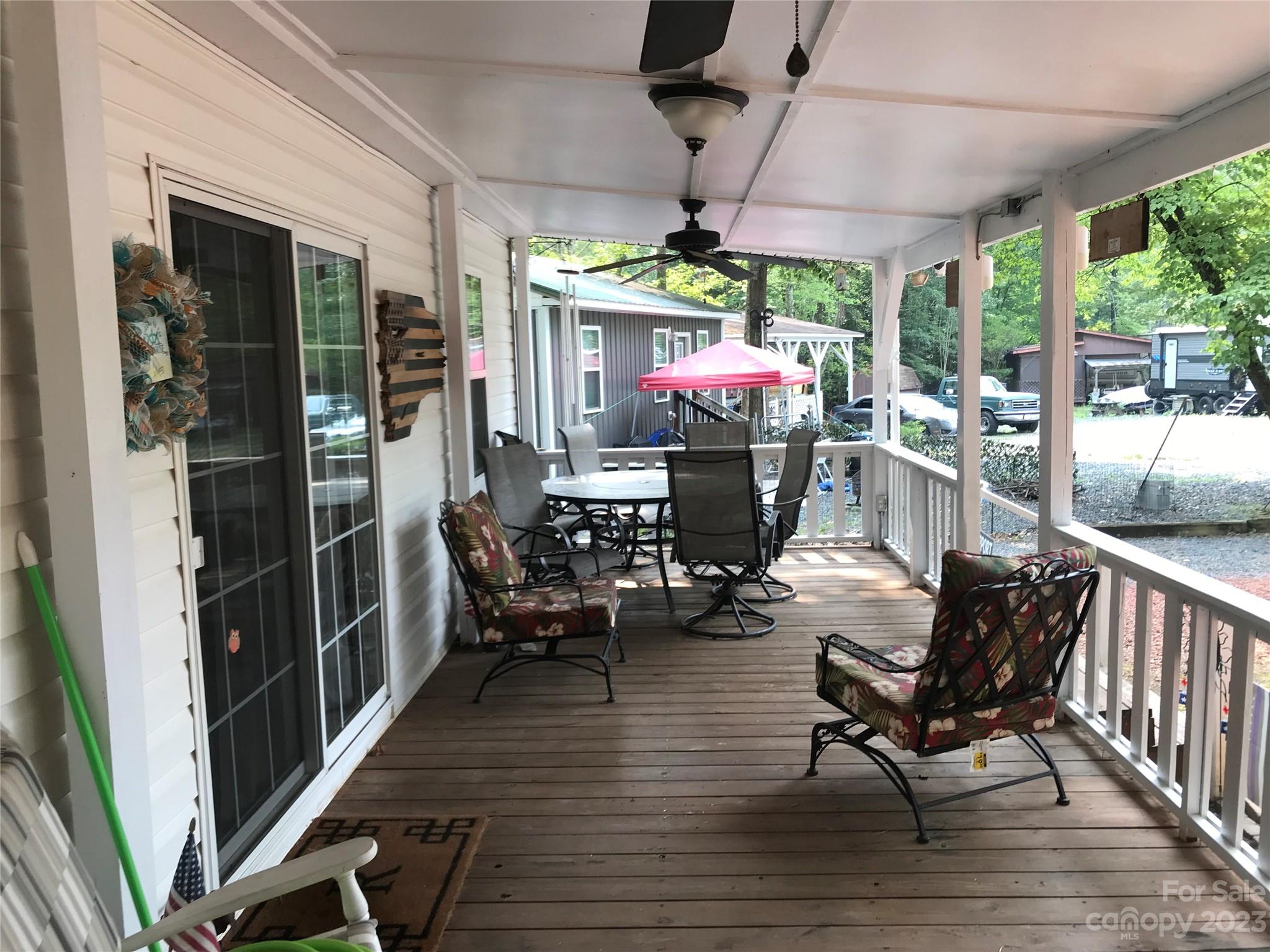154 Roberts Ridge Road Mount Gilead, NC 27306 - Photo 8 of 35 a view of a chairs in a patio