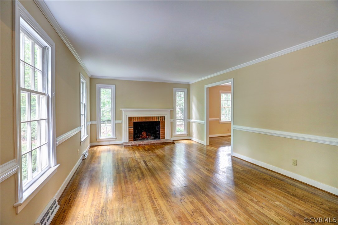 1970 Castlebridge Road Midlothian, VA 23113 - Photo 4 of 28 a view of empty room with wooden floor and fireplace